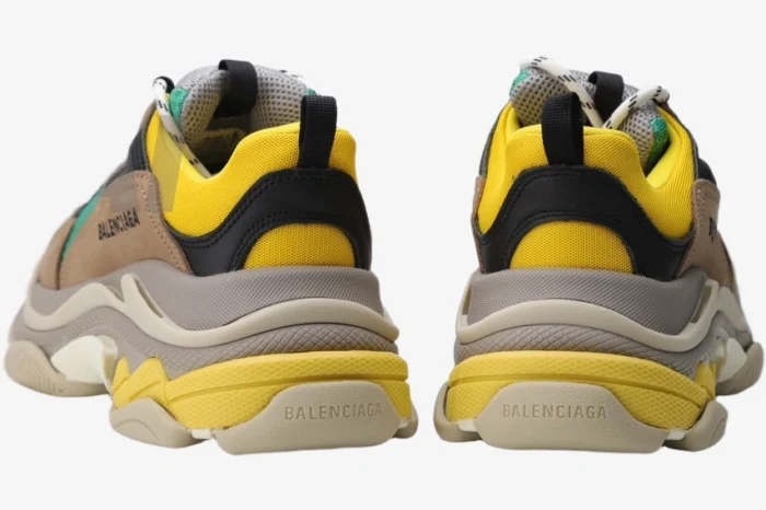 Rear view of Balenciaga Triple S Curry sneakers in brown, yellow, and tan with layered soles. - SKU 533882W09O22311