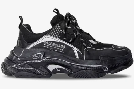 Balenciaga Triple S 'Sketch - Black' sneaker in a side profile view with white hand-drawn graphics.