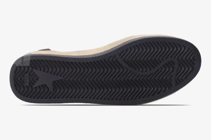 Bottom view of Golden Goose Ball Star sneakers showing black herringbone rubber outsole and star logo. - SKU GMF00117.F002573.10915