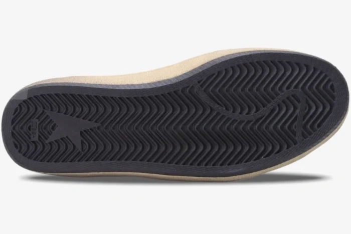 Bottom view of Golden Goose Ball Star sneaker showing black rubber outsole with herringbone pattern. - SKU GMF00117.F002517.10887