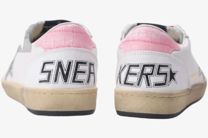 Rear view of Golden Goose Ball Star white sneakers featuring pink crocodile heel tabs and black SNEAKERS text. - SKU GWF00117.F002517.10893
