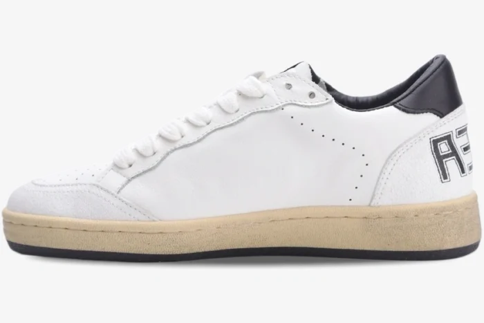 Side view of Golden Goose Ball Star Sport Sneaker in white and black with cream midsole. - SKU GMF00117.F002554.10100