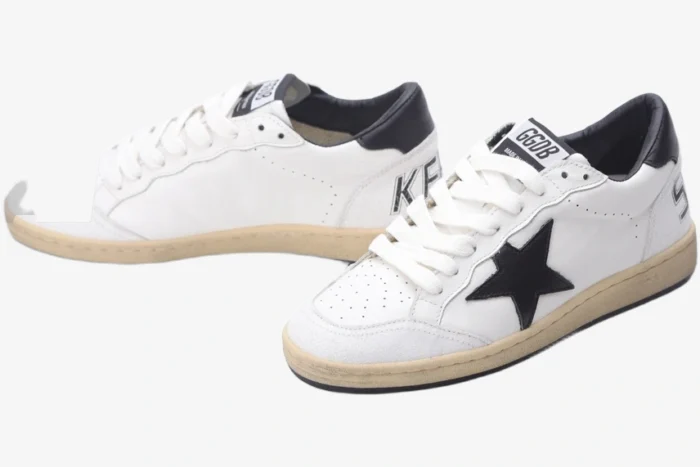 Golden Goose Ball Star Sport sneakers in white and black leather, three-quarter front view. - SKU GMF00117.F002554.10100