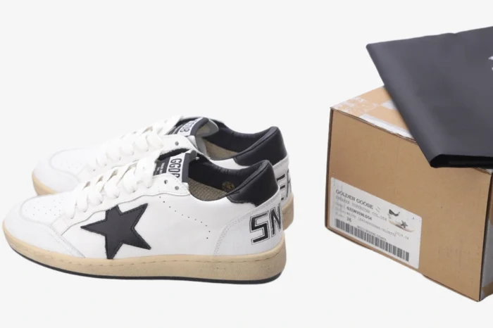 Golden Goose Ball Star Sport Sneaker in white and black with original box, side view. - SKU GMF00117.F002554.10100