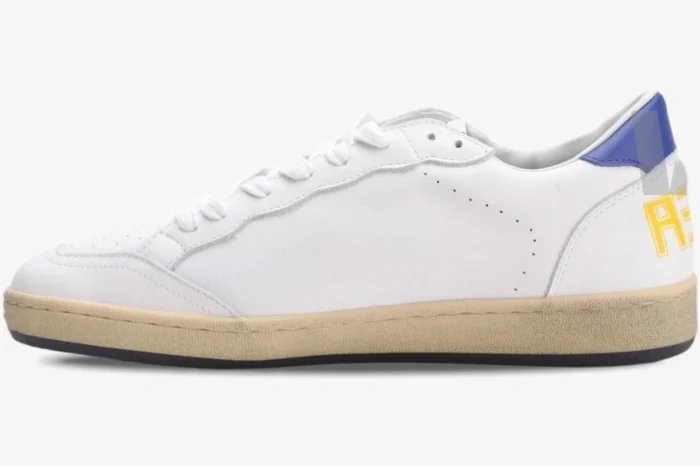 Side view of Golden Goose Ball Star white leather sneaker with blue heel and distressed cream sole. - SKU GMF00117.F002517.10887