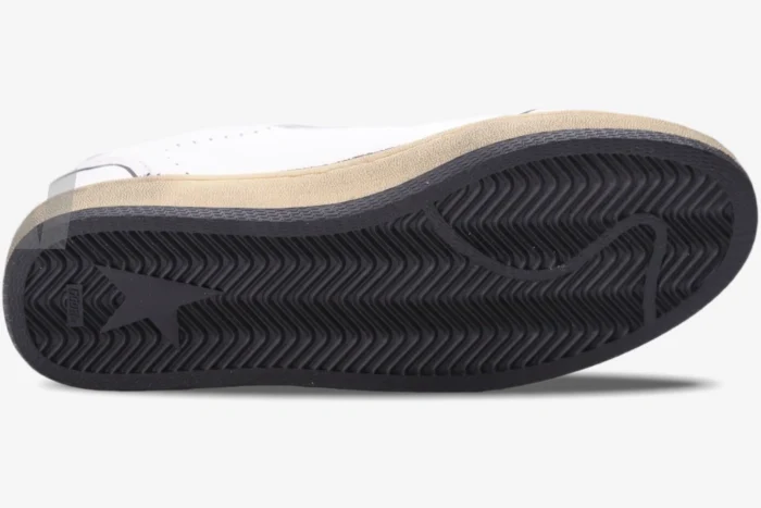 Bottom view of Golden Goose Ball Star sneaker showing black herringbone rubber sole and tan midsole. - SKU GMF00117.F002575.10915