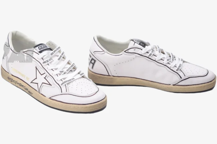 White Golden Goose Ball Star sneakers with brown outlines and star logo, shown from a three-quarter angle. - SKU GMF00117.F002575.10915