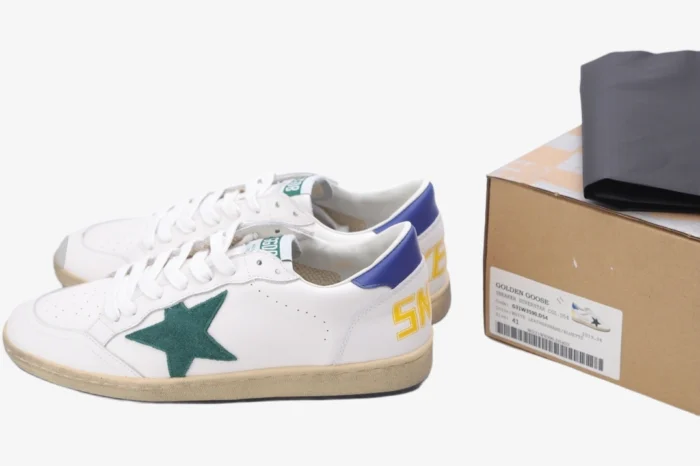 Golden Goose Ball Star white leather sneakers with green star and blue heel, side view next to box. - SKU GMF00117.F002517.10887
