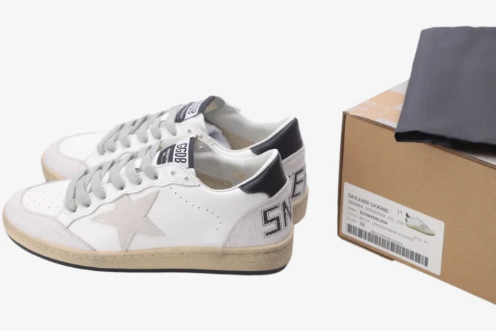 Side view of Golden Goose Ball Star white grey black distressed leather sneakers with original box.