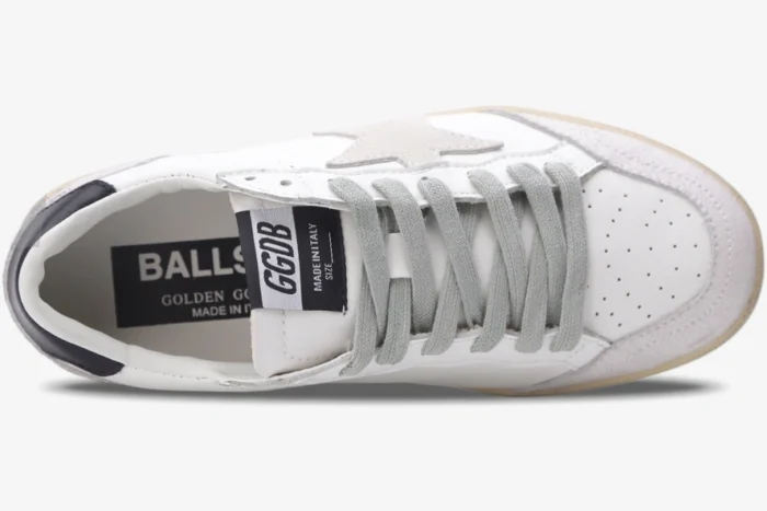 Top-down view of Golden Goose Ball Star sneakers in white, grey, and black distressed leather with grey laces.