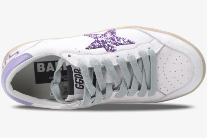 Top-down view of white Golden Goose Ball Star sneakers featuring a purple glitter star and grey laces. - SKU GWF00117.F002544.10915