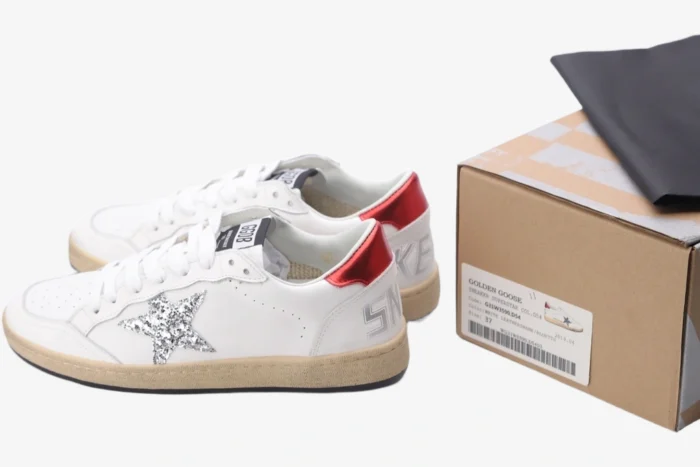 White Golden Goose Ball Star sneakers featuring a silver glitter star and red heel tab, side view with box. - SKU GWF00117.F002517.10892