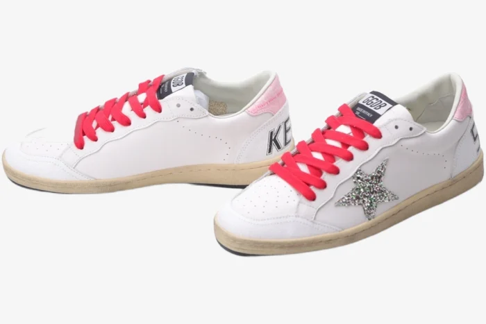 Golden Goose Ball Star white sneakers with red laces and silver glitter star, side view. - SKU GWF00117.F002517.10893
