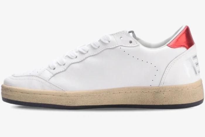 Side profile of a Golden Goose Ball Star white leather sneaker featuring a metallic red heel tab. - SKU GWF00117.F002517.10892