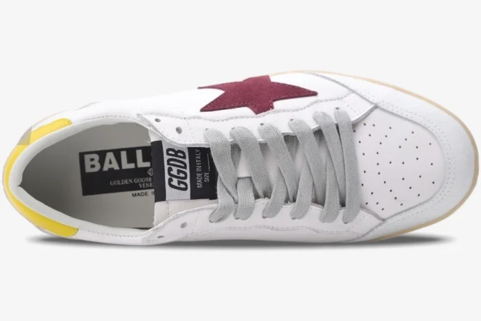Top-down view of Golden Goose Ball Star white leather sneaker with red star and yellow heel. - SKU GMF00117.F002558.10915
