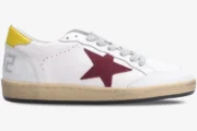 Golden Goose Ball Star sneaker in white leather with red suede star and yellow heel, side view. - SKU GMF00117.F002558.10915