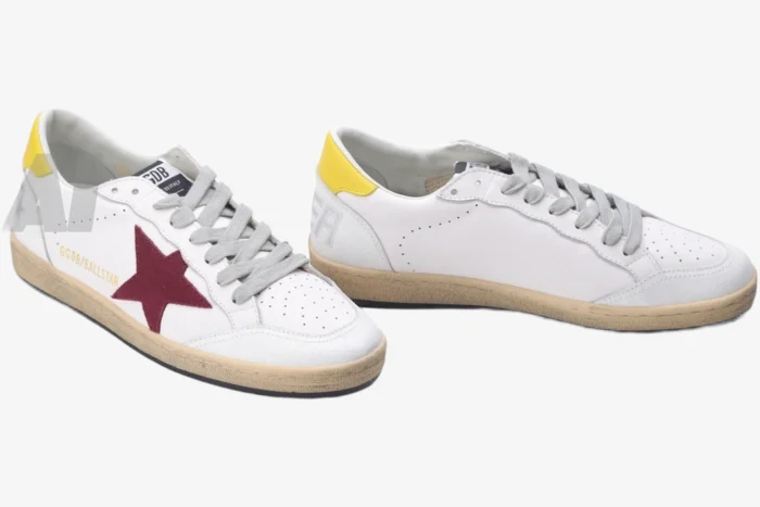 Golden Goose Ball Star white leather sneakers with red star and yellow heel, three-quarter view. - SKU GMF00117.F002558.10915