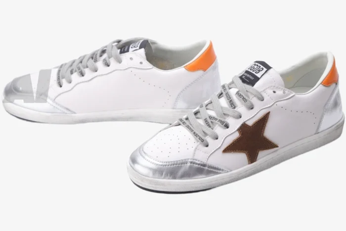 Golden Goose Ball Star sneakers in white and silver with a brown star, three-quarter view. - SKU GMF00117.F002585.10912