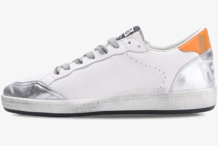 Side view of white Golden Goose Ball Star sneakers featuring silver metallic details and a brown heel tab. - SKU GMF00117.F002585.10912