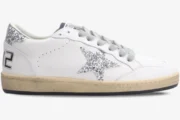 Side view of Golden Goose Ball Star sneakers in white leather with a silver glitter star and heel. - SKU GWF00117.F002564.10273