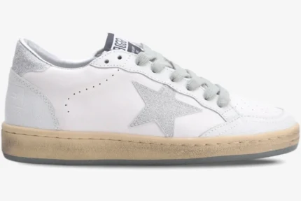 Side view of Golden Goose Ball Star sneakers in white leather with a silver glitter star and heel tab. - SKU GWF00117.F002573.10915