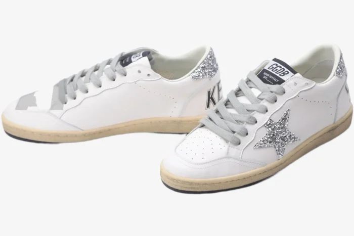 Golden Goose Ball Star sneakers in white leather with silver glitter star and heel, three-quarter view. - SKU GWF00117.F002564.10273