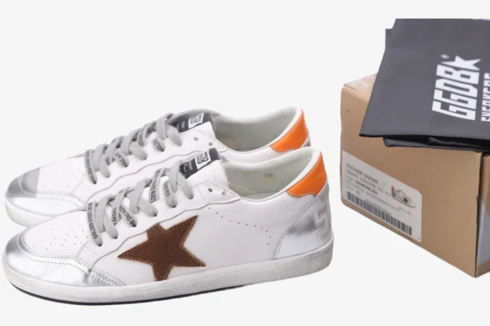 Golden Goose Ball Star white and silver sneakers with brown star and orange heel tab, side view. - SKU GMF00117.F002585.10912