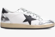 Side view of Golden Goose Ball Star white and silver distressed sneakers with a black star. - SKU GWF00117.F002517.10272