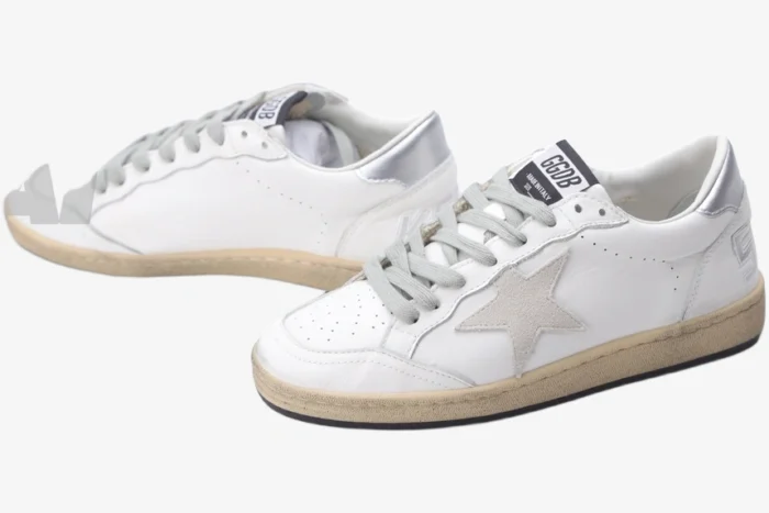 Golden Goose Ball Star white and silver distressed leather sneakers shown from a three-quarter side angle. - SKU GWF00117.F002570.10925
