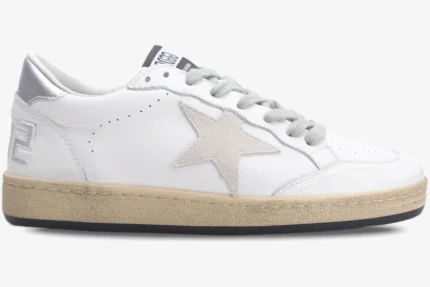 Side view of a Golden Goose Ball Star white leather sneaker with a silver heel and beige distressed sole. - SKU GWF00117.F002570.10925