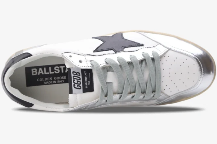 Top view of Golden Goose Ball Star white and silver sneakers with grey laces and black star. - SKU GWF00117.F002517.10272