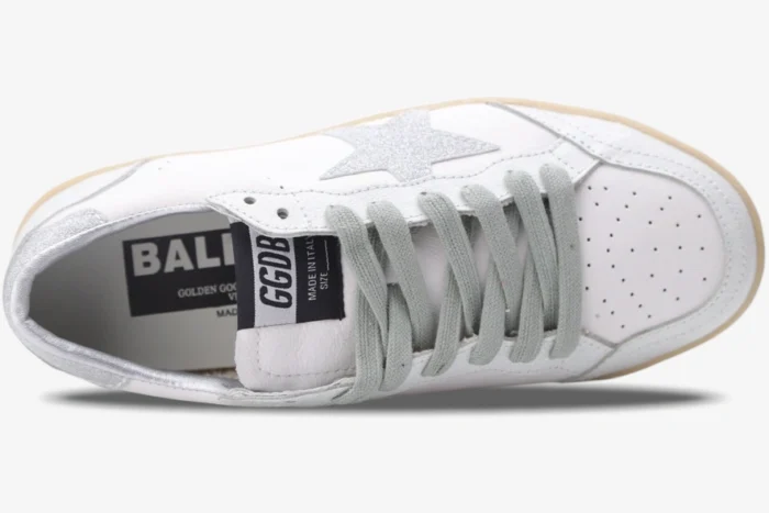 Top-down view of Golden Goose Ball Star white leather sneakers with silver glitter star and grey laces. - SKU GWF00117.F002573.10915