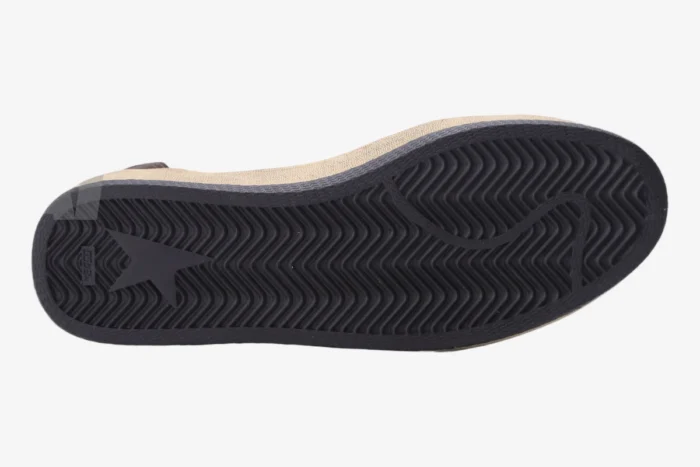 Bottom view of Golden Goose BallStar sneaker featuring a black herringbone outsole with a star logo. - SKU GMF00117.F000632.10273