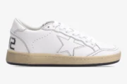 Side view of Golden Goose BallStar white leather sneakers with black outlines and distressed tan soles. - SKU GMF00117.F000632.10273