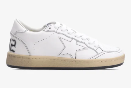 Side view of Golden Goose BallStar white leather sneakers with black outlines and distressed tan soles. - SKU GMF00117.F000632.10273