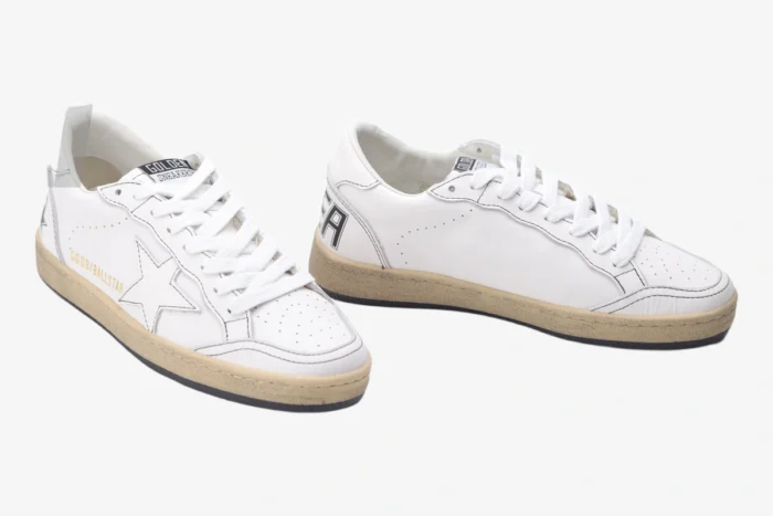 Golden Goose BallStar white distressed leather sneakers with white star and gold logo, three-quarter view. - SKU GMF00117.F000632.10273