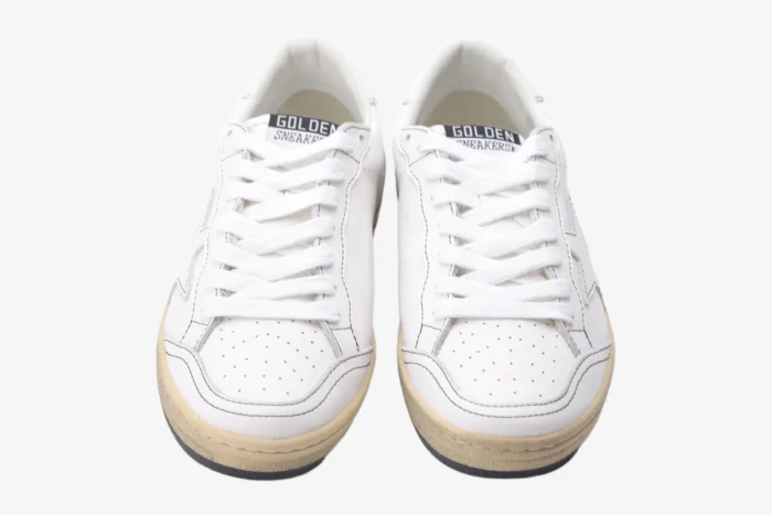 Front view of white Golden Goose BallStar distressed leather sneakers with white laces and cream soles. - SKU GMF00117.F000632.10273