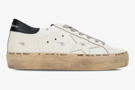 Golden Goose white and black Hi Star platform sneakers in a side profile view with distressed details. - SKU GWF00118.F000329.10271