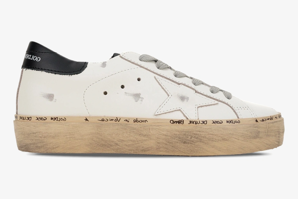 golden-goose-hi-star-platform-white-black-side-gwf00118-f000329-10271-887-332 Golden Goose white and black Hi Star platform sneakers in a side profile view with distressed details. - SKU GWF00118.F000329.10271