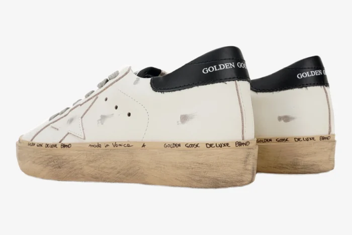 Rear side view of white and black Golden Goose Hi Star platform sneakers with distressed soles. - SKU GWF00118.F000329.10271