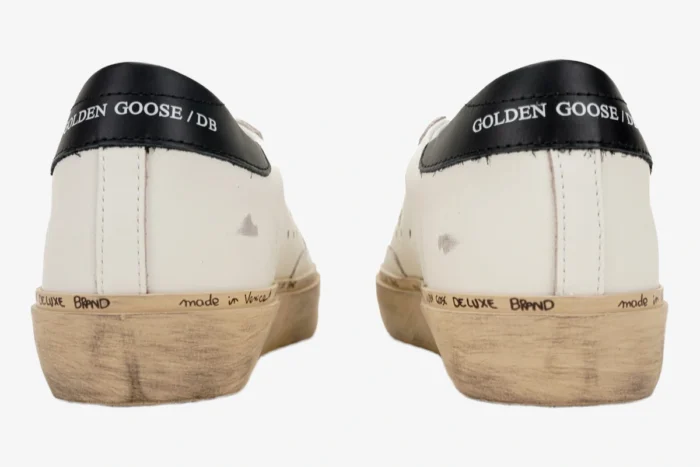 Rear view of Golden Goose white and black Hi Star platform sneakers with distressed soles. - SKU GWF00118.F000329.10271