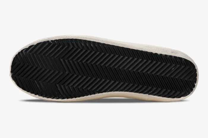 Bottom view of Golden Goose Super-Star sneaker showing black herringbone rubber outsole. - SKU GMF00101.F000312.10273