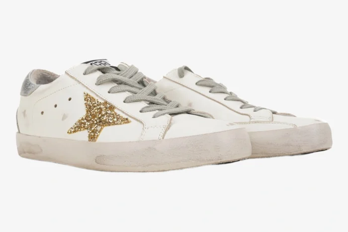Golden Goose Super-Star sneakers in white with gold glitter star and silver heel, side view. - SKU GWF00101.F000312.10272