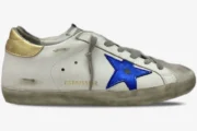 Golden Goose Super-Star distressed white leather sneaker with navy star and gold heel tab, side view. - SKU GMF00101.F000312.10272