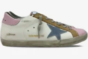 Side profile of Golden Goose Super-Star sneakers in white with pink accents, a blue star, and brown details.