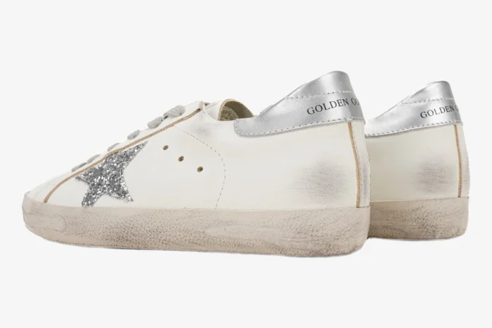 Golden Goose Super-Star white leather sneakers with silver glitter star and silver heel tab, side and back view. - SKU GWF00101.F000312.80185