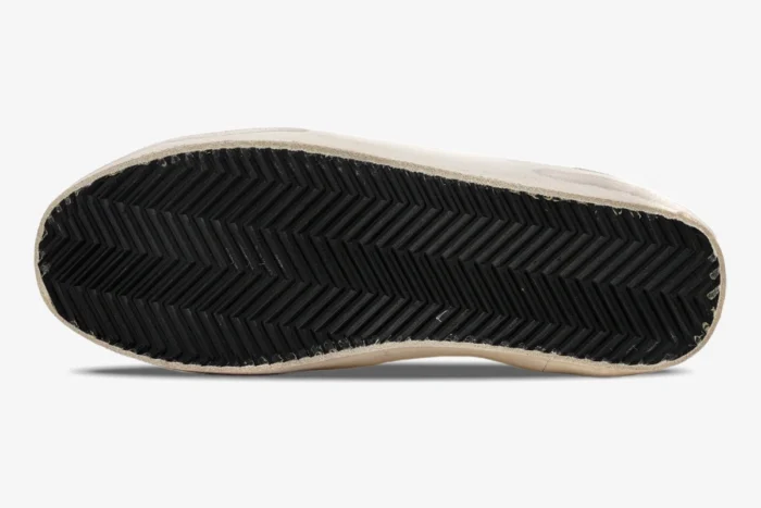 Bottom view of Golden Goose Super-Star sneaker showing black herringbone tread sole. - SKU GWF00101.F000312.10272