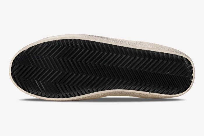 Bottom view of Golden Goose Super-star sneaker showing black herringbone rubber sole. - SKU GWF00101.F000312.10273