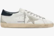 Golden Goose Super-Star white leather sneaker with suede star and blue heel tab, side profile view. - SKU GMF00101.F000312.10273