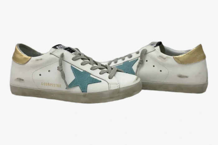 Golden Goose Super-Star white leather sneakers with green suede star and gold heel tab, side view. - SKU GWF00101.F000312.10273